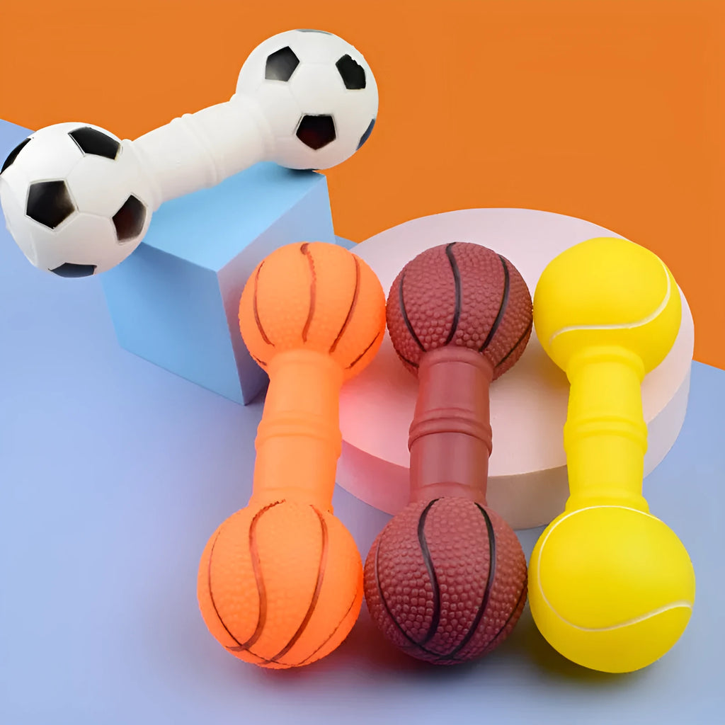 Colourful PVC football dumbbell shaped dog toy on a plain background.