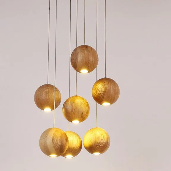 Nordic style solid wood ball chandelier pendant light with adjustable cord.