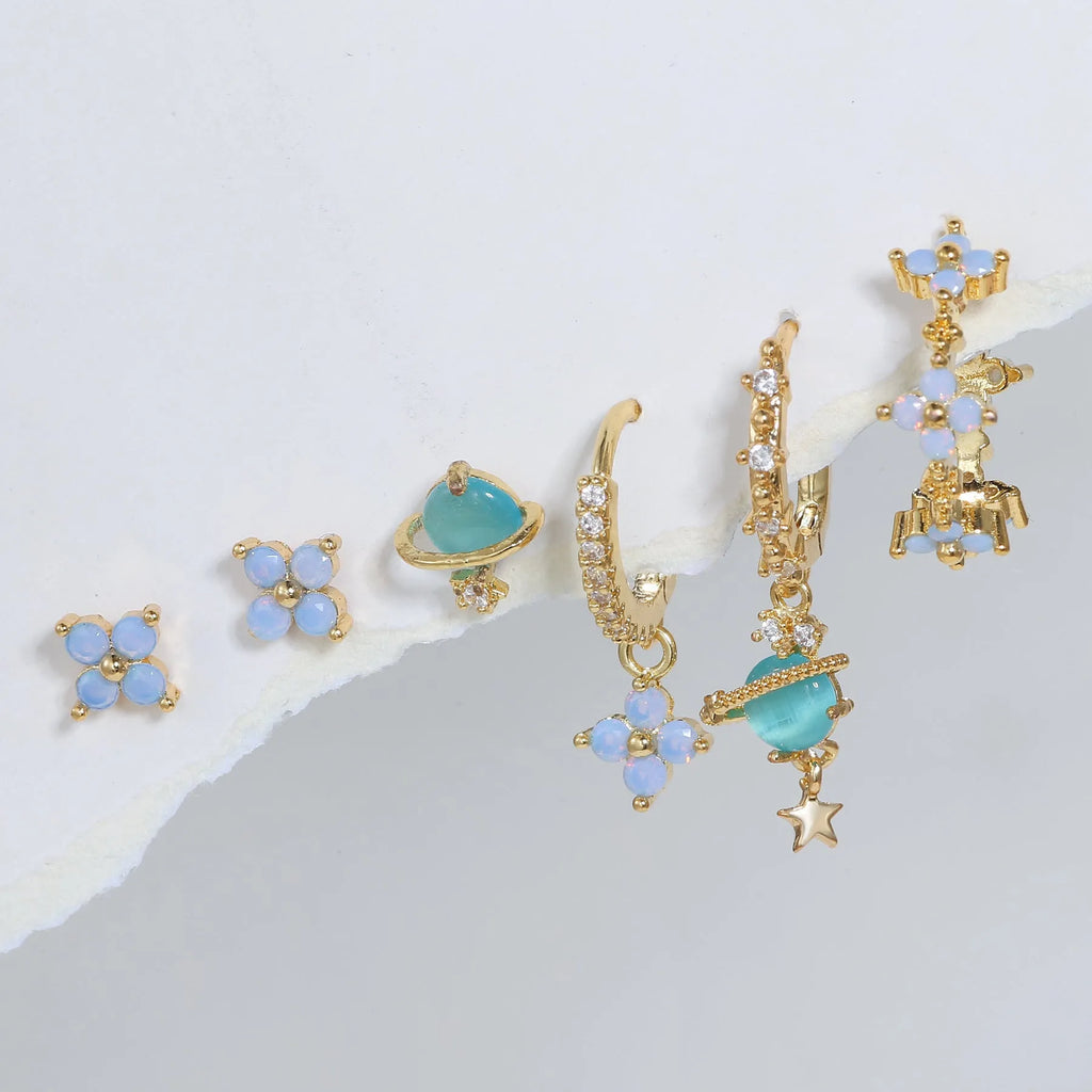Gold and silver Japanese Korean style flower earrings studs with blue zircon mosaic detail.