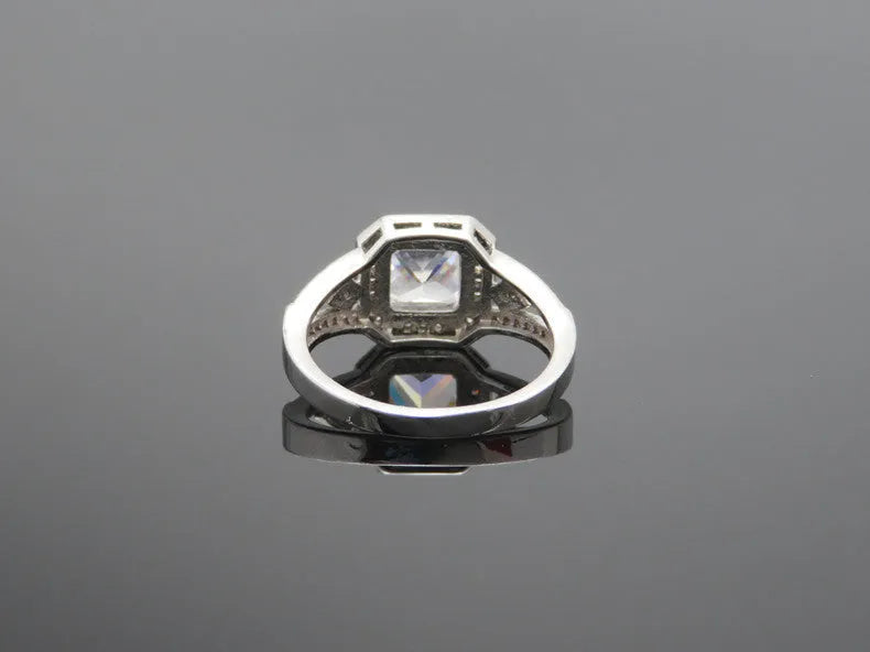 Geometric women's zircon ring with hollow ornamentation in platinum colour