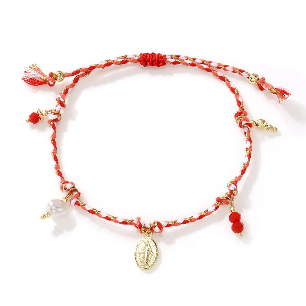 Close-up of hand-woven colourful braided rope bracelet with ethnic style and carrying strap tag function