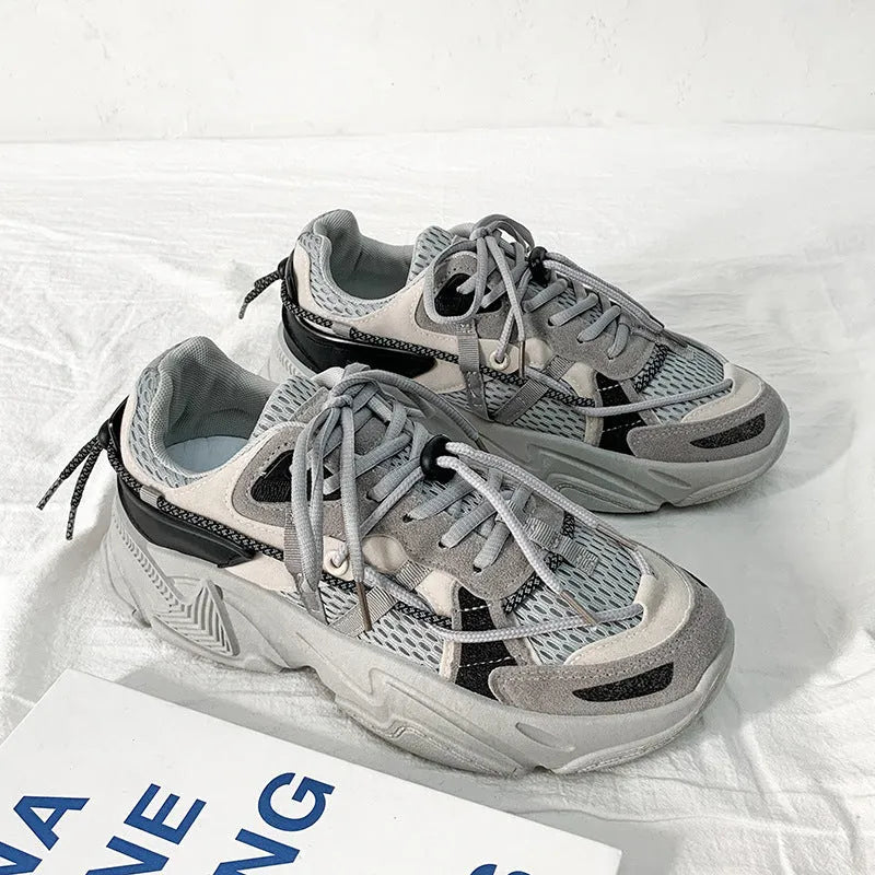 Men's white platform dad shoes with front lace-up, shown on a neutral background.
