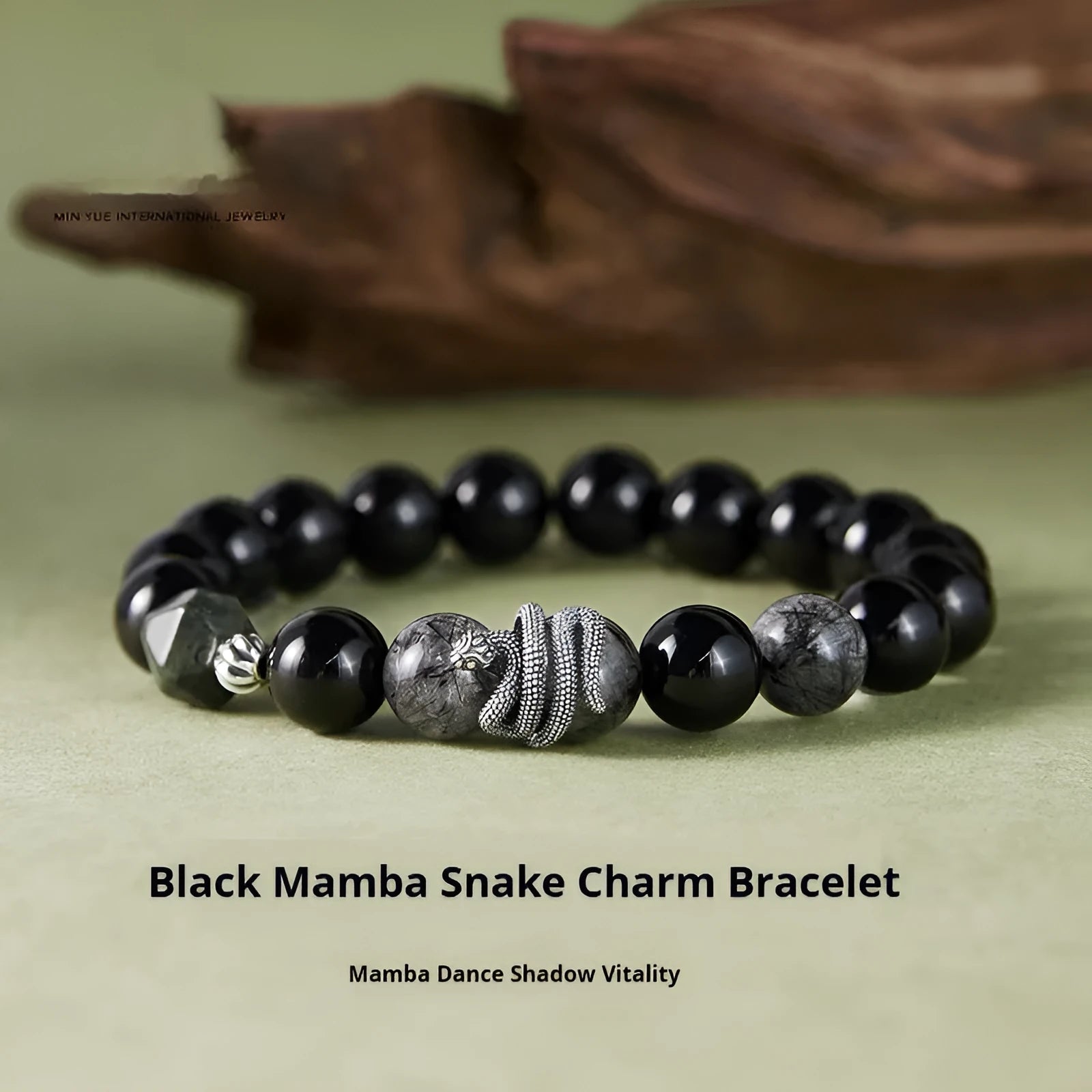 Men's S925 sterling silver snake zodiac bracelet with black obsidian charm on wrist