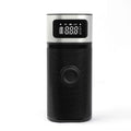 Black portable wireless vehicle air pump with USB charging cable and multiple inflation nozzles including bicycle and ball attachments