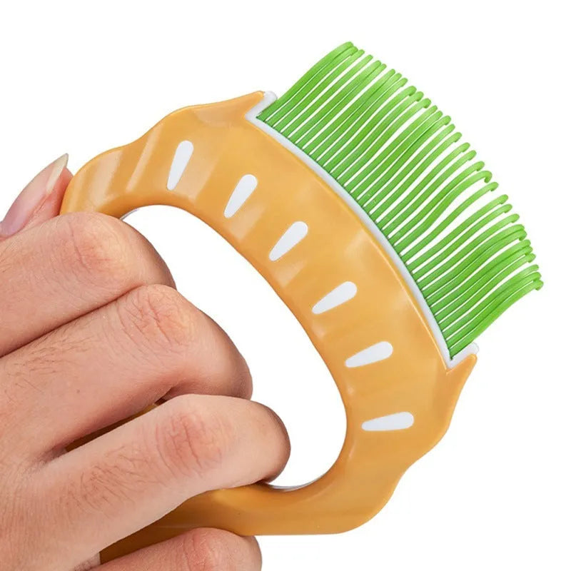 Shell shaped pet grooming brush in green, orange, or purple colours for dogs and cats
