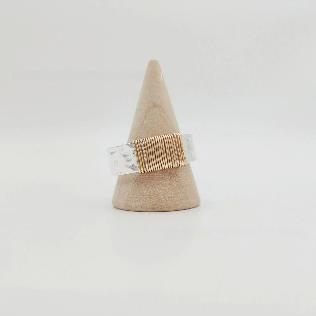 Copper geometric bracelet with irregular coil design in electroplated silver gold colour