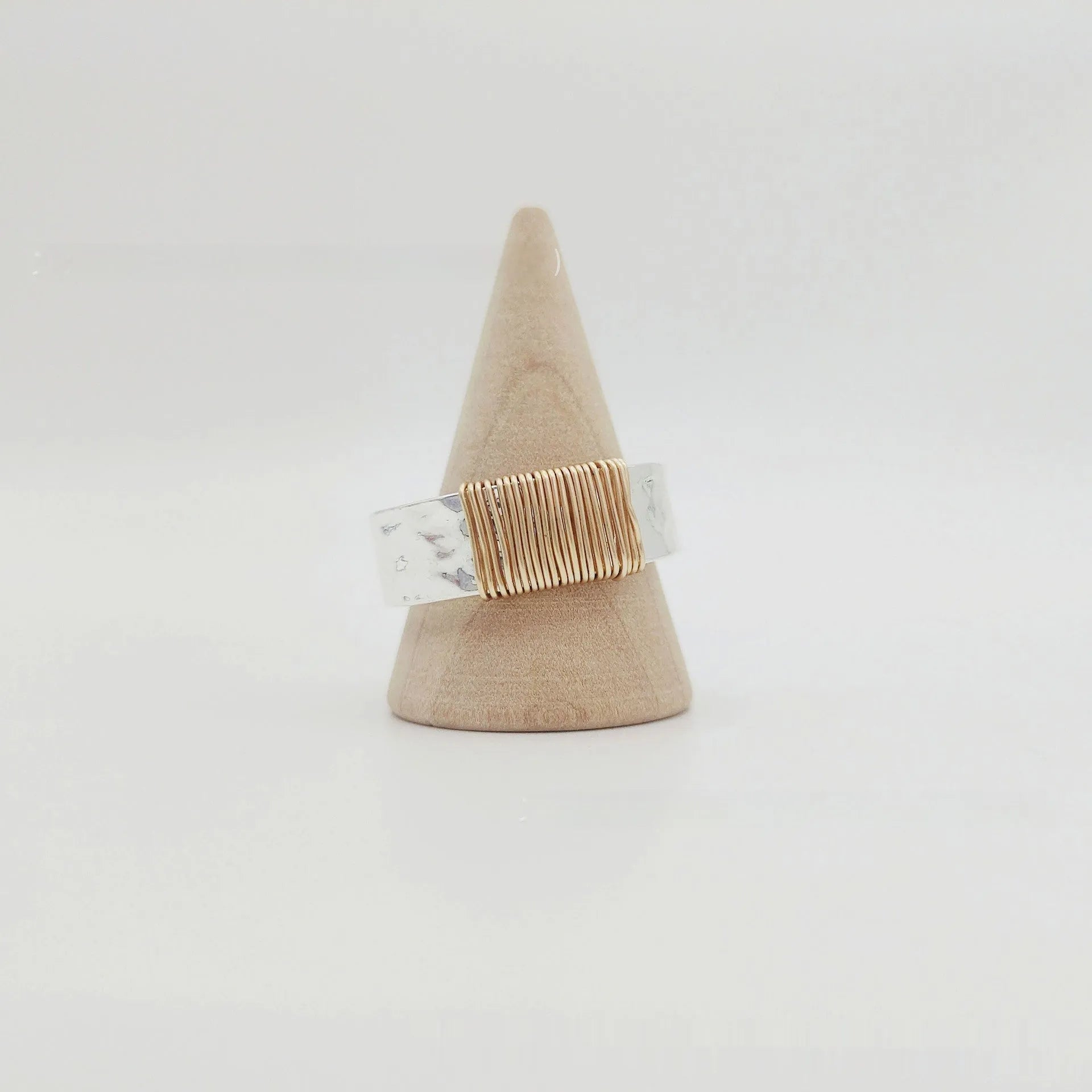 Copper geometric bracelet with irregular coil design in electroplated silver gold colour