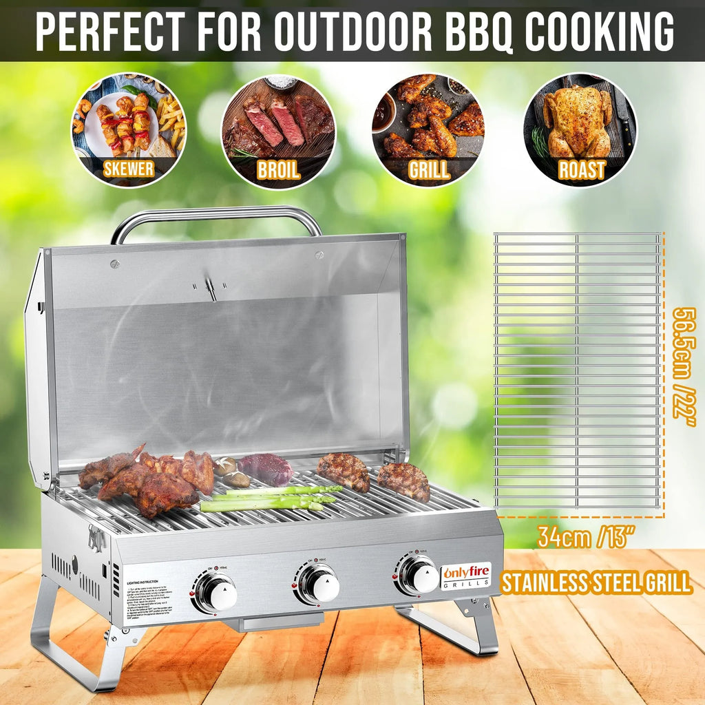 Silver desktop gas barbecue grill with three stainless steel burners and foldable legs