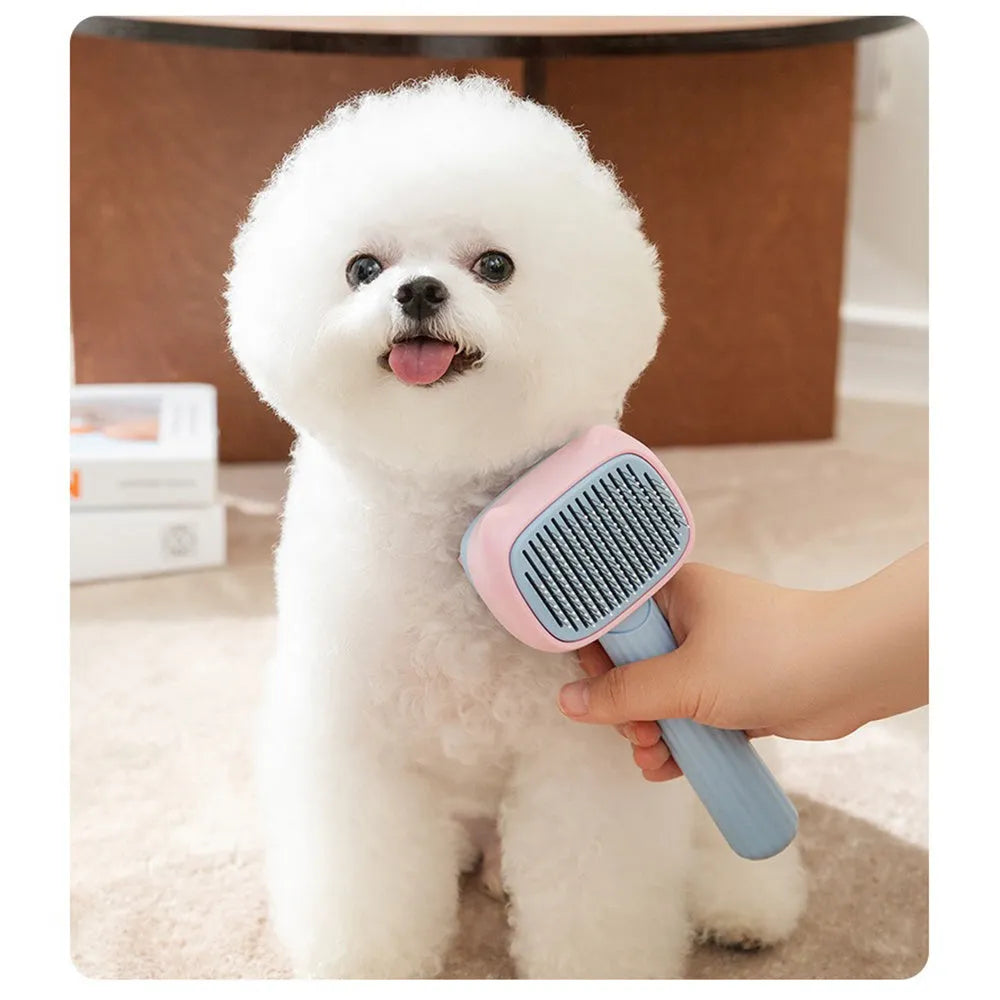 Red double-sided pet grooming brush with de-shedding rake and de-matting comb on a white background