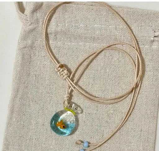 Women's pendant necklace with coloured glaze joker charm on cotton linen chain