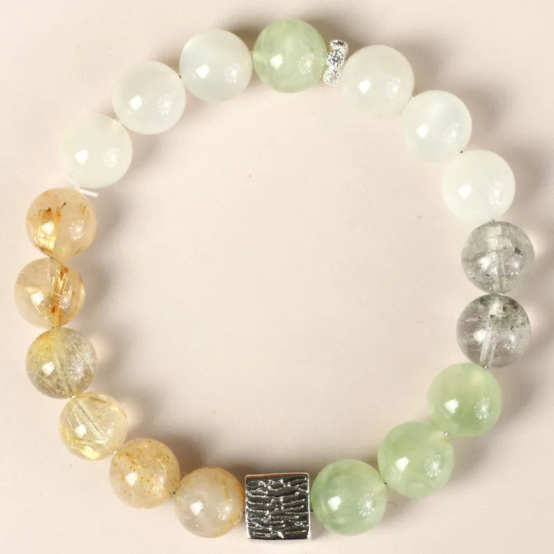 Polished crystal bracelet in khaki with 10mm geometric beads on a neutral background