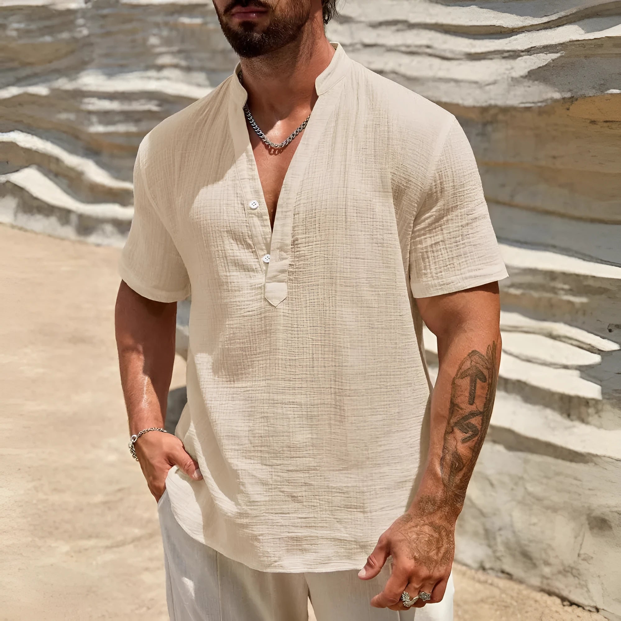 Men's solid colour stand collar short-sleeved shirt in a light blue shade on a hanger.