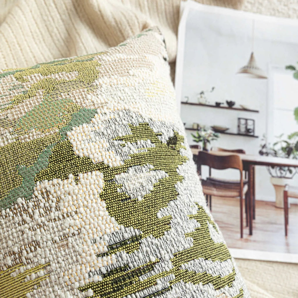 Antique green abstract decorative pillow with French style spring flowers pattern, shown in square and waist pillow sizes.