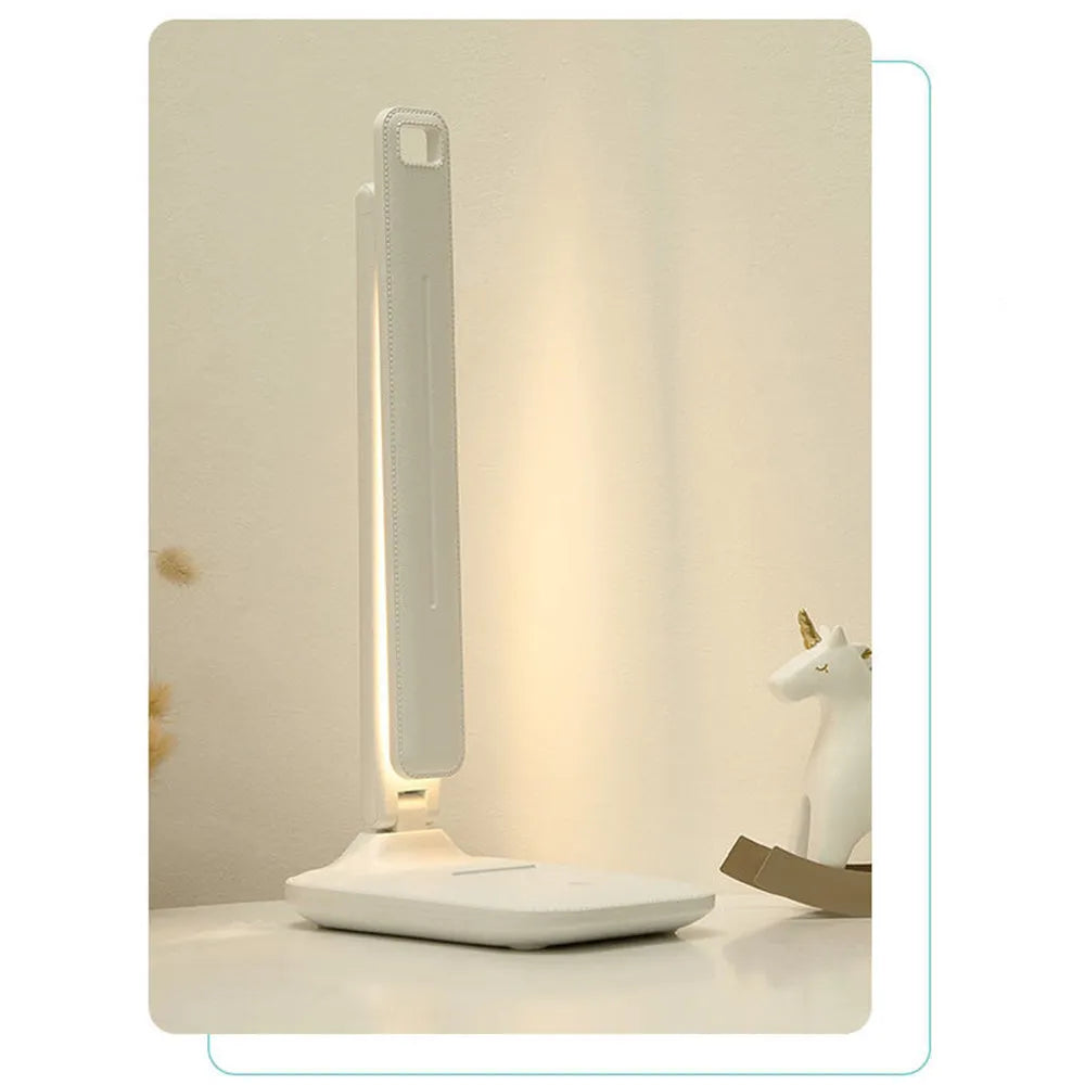 White plastic bedside lamp with touch controls and USB charging port