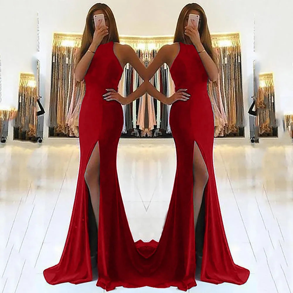 Long red knitted evening dress with hollow detail, hanging neckline, high waist, and a large swing skirt.