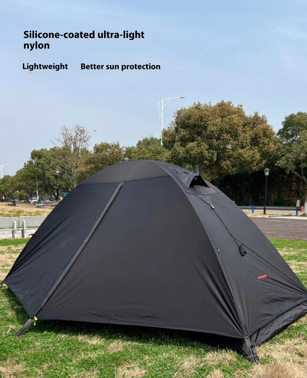 Single person lightweight camping tent with aluminium poles in red colour showing double-layer construction