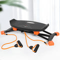 Black JS101A mini fitness skiing machine with elastic hand straps on a home floor
