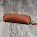 Genuine cowhide leather pencil case in square design with zipper closure measuring 18cm