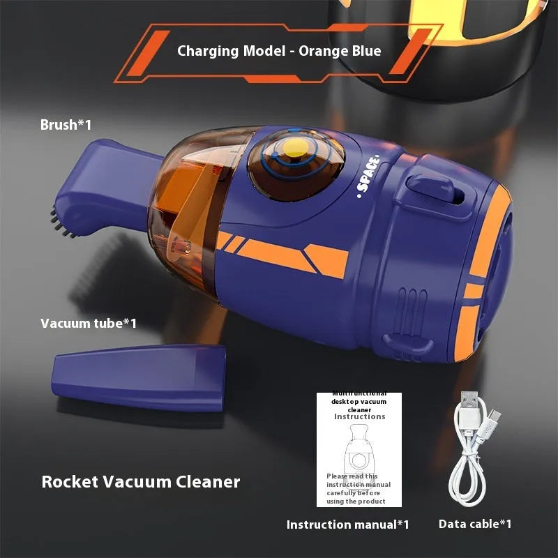 Blue USB rechargeable handheld desktop vacuum cleaner on a wooden desk next to a keyboard.