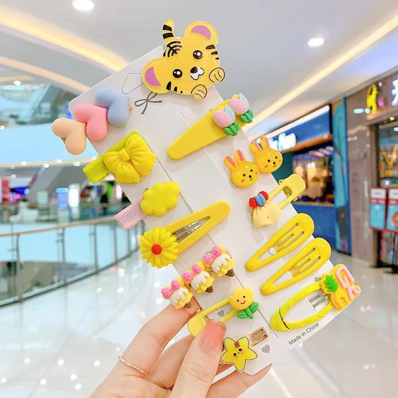 14-piece toddler hair accessories set: colourful rainbow, fruit, and butterfly barrettes in soft silicone clay.