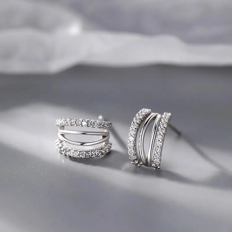 A pair of geometry-shaped 925 silver needle earrings with an electroplated finish, shown in large, medium, and small size options.