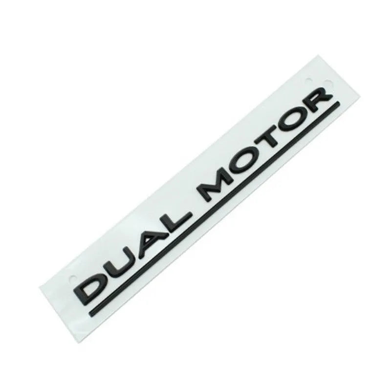 Tesla Model 3 Dual Motor bumper sticker in ABS plastic, shows matte black and silver colour options.