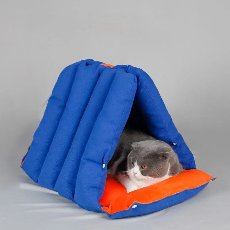 Triangular blue cotton cat nest with drilled holes for deforming, 45x38x38cm, on a wooden floor