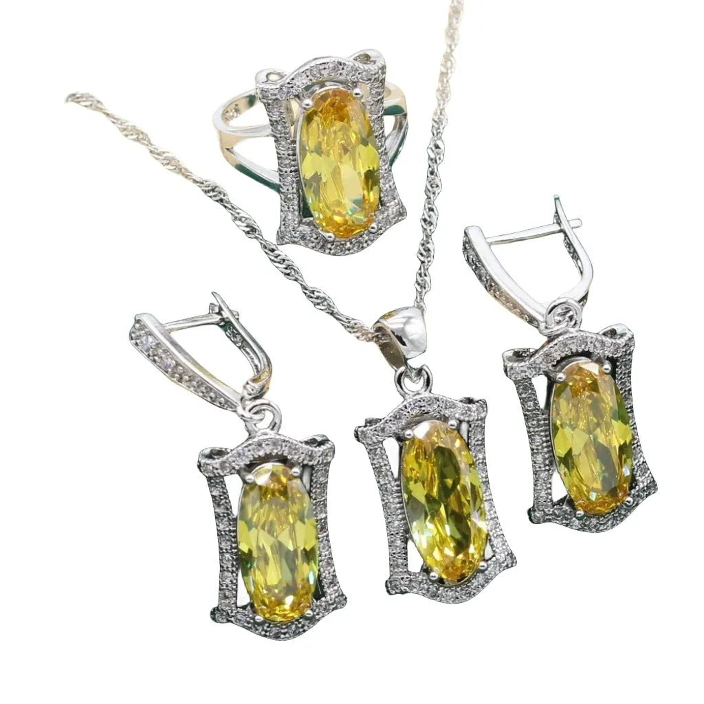 Yellow anti-allergy zircon jewellery set showing necklace, earrings, ring, and bracelet on a snake bone chain.