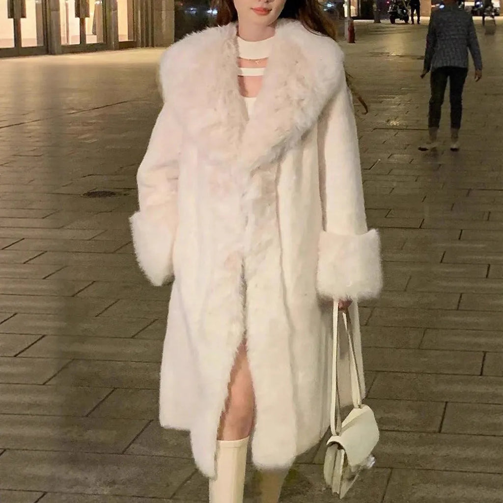 Grey women's mid-length faux rabbit fur coat with a shawl collar, shown on a model.