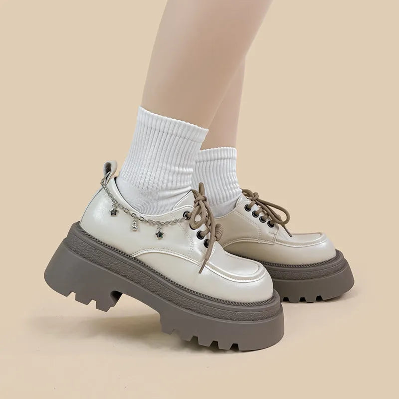British-style white platform leather shoes with chunky heel and front lace-up closure