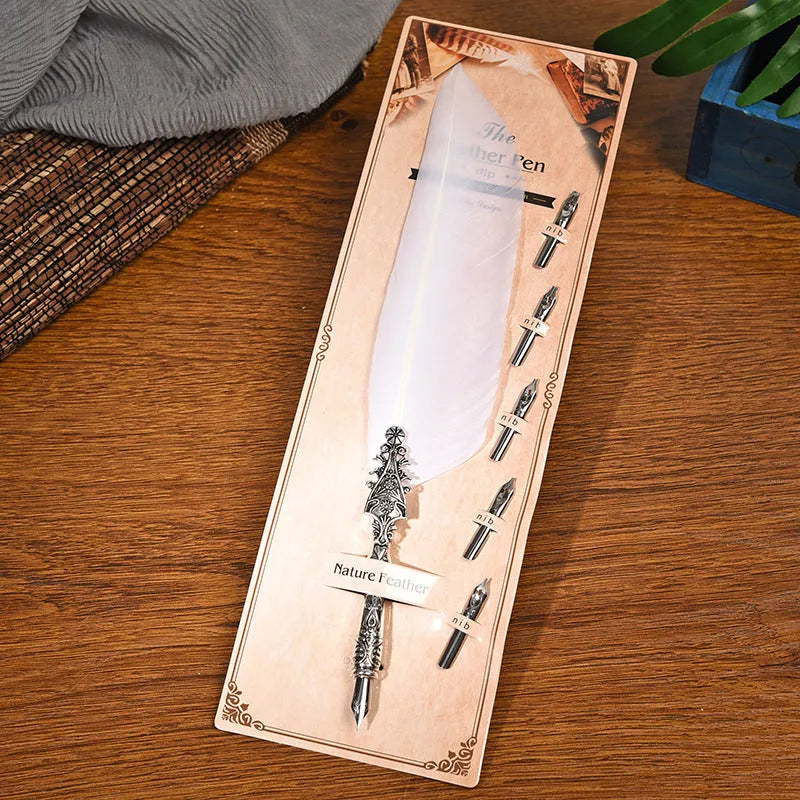 Vintage feather dip pen with zinc alloy shell in a choice of ten colours on a desk.