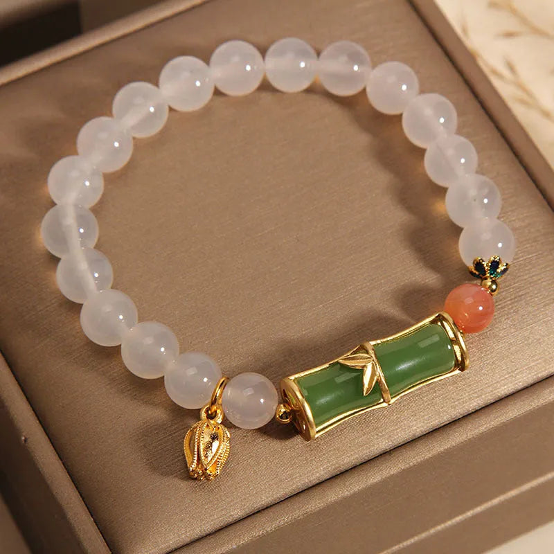 White agate and jade bamboo beaded bracelet on wrist, natural stone jewellery for women