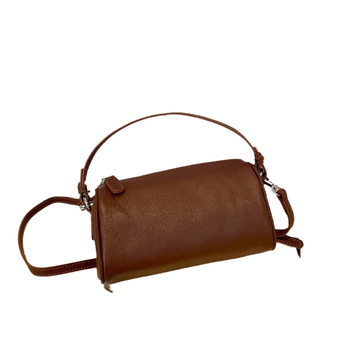 Genuine leather cylindrical crossbody phone bag in multiple colours with an adjustable strap.