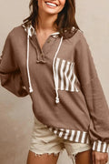 Straw yellow long sleeve hoodie with waffle texture, striped patchwork, button neck, and drawstring hood.