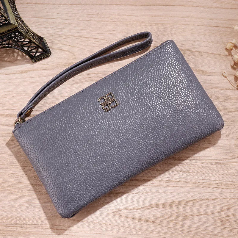 Long 55-inch phone wallet handbag in a choice of colours with zipper closure and sewing line detail