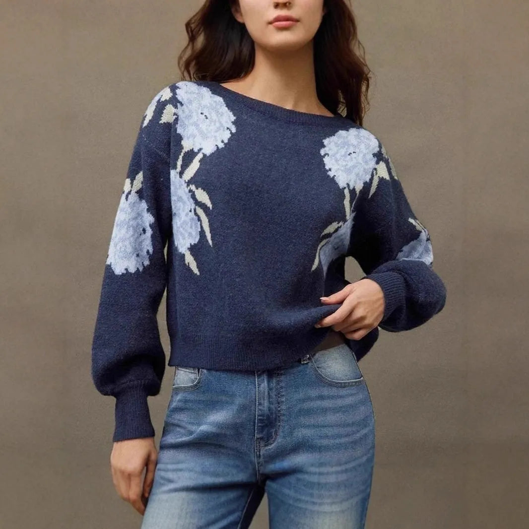 Women's loose-fit sapphire blue pullover with white flower jacquard pattern and long sleeves.