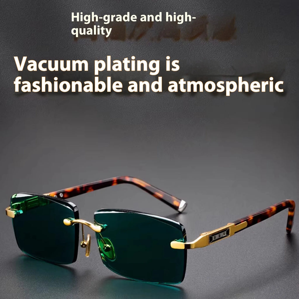 A pair of frameless dark green crystal sunglasses with a hard case and lens cloth.