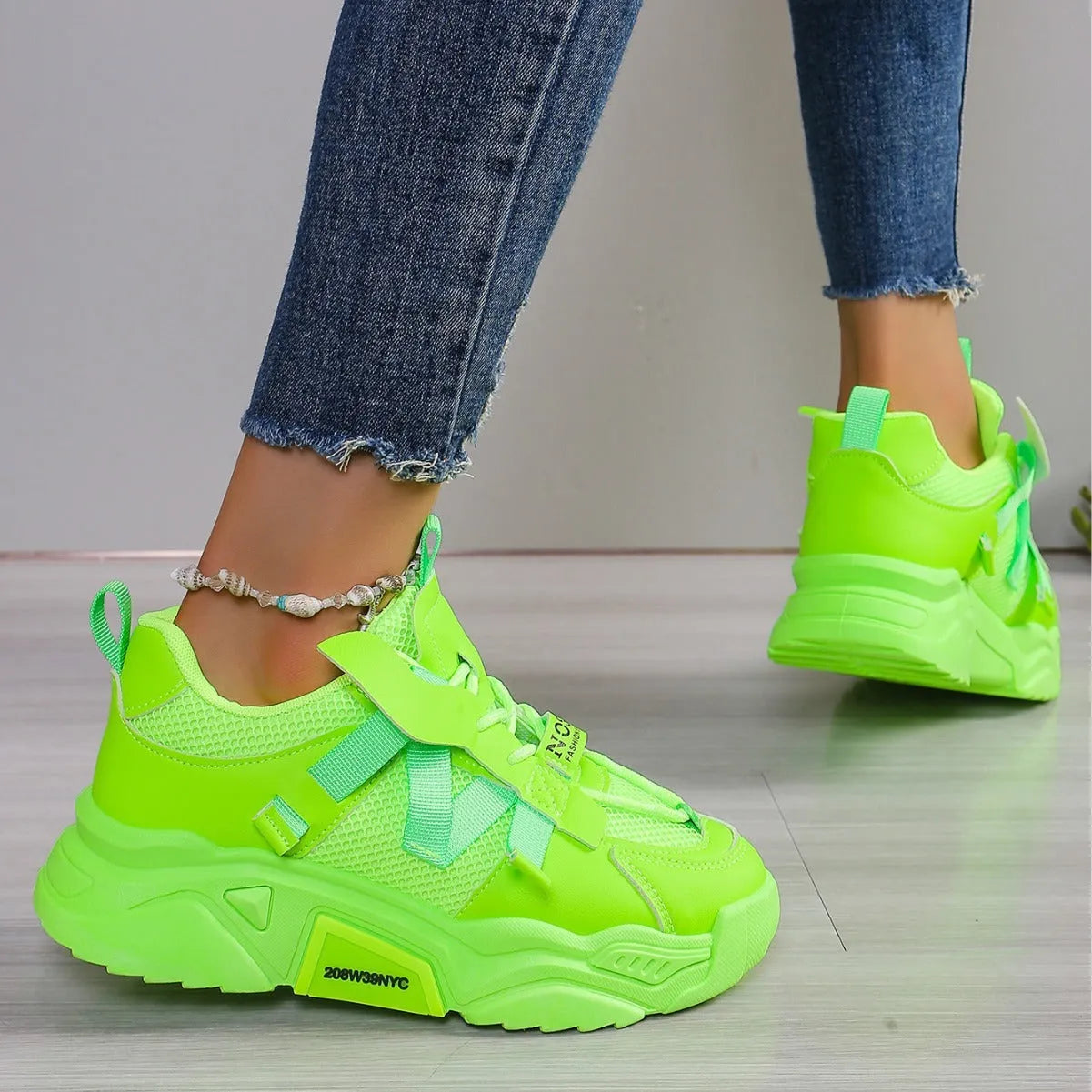 Women's platform sports sneakers in multiple colours with mesh upper and lace-up front.