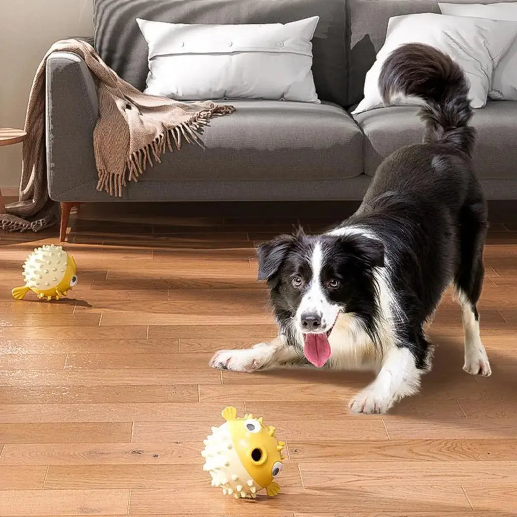 Yellow fish-shaped vinyl dog chew toy with textured surface and squeaker for aggressive chewers