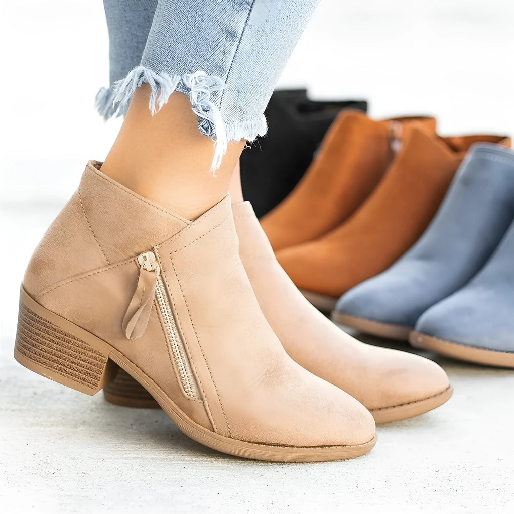 Women's suede ankle boots with chunky heel and side zip fastening in beige, black, blue, and orange colours