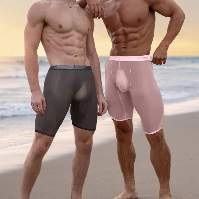 Men's solid colour mesh shorts in black, shown on a hanger, highlighting knitted fabric.