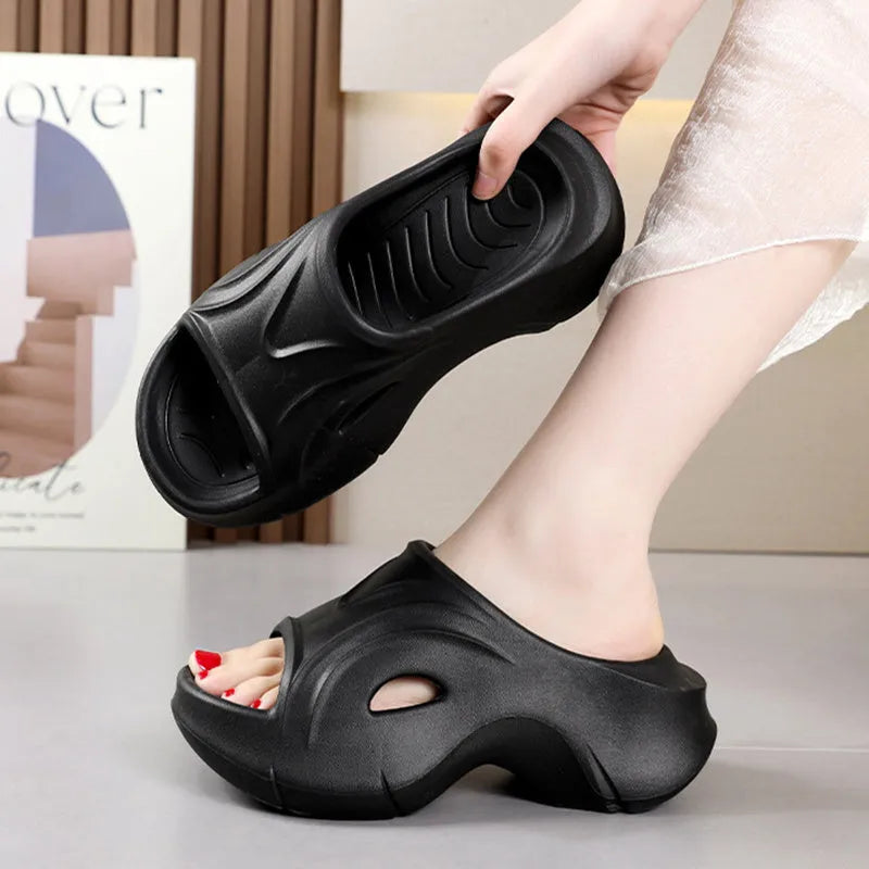 Women's thick-soled EVA slippers in rose red colour with round toe.