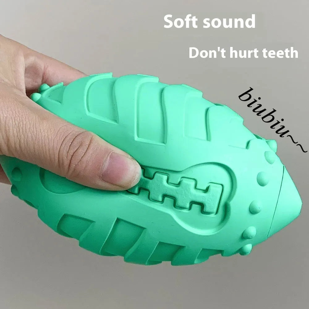 Light green bite-resistant rubber rugby ball dog toy with vocal feature for teeth cleaning and training.