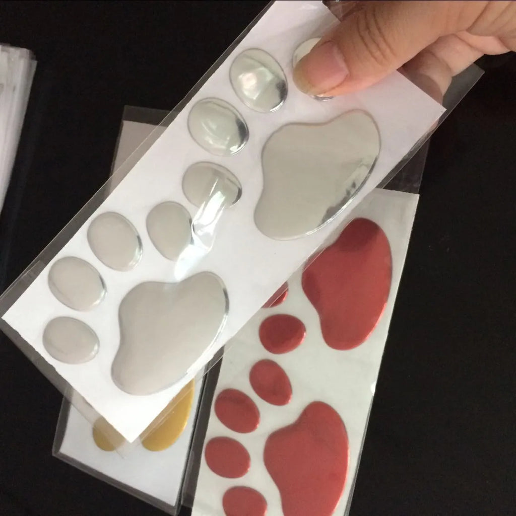 PVC hand-shaped brush car sticker with dog footprints pattern in black, silver, red, or gold.