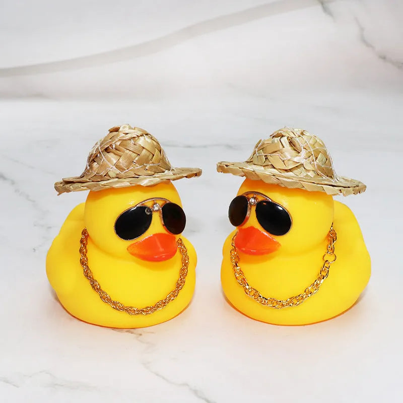 Yellow cartoon duck with straw hat car dashboard ornament on adhesive base with sunglasses necklace