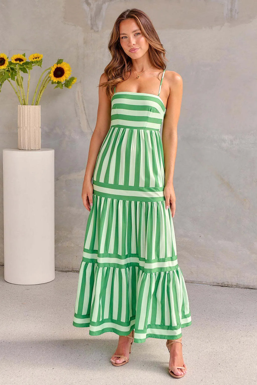 Women's striped summer dress with backless square neck, suspender straps, and side pockets