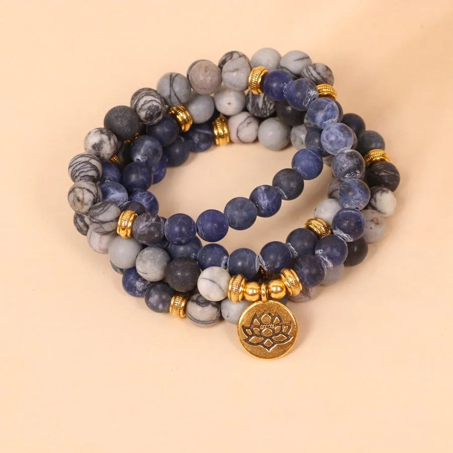 Multi-layer alloy women's bracelet with blue patterned network stone beads.
