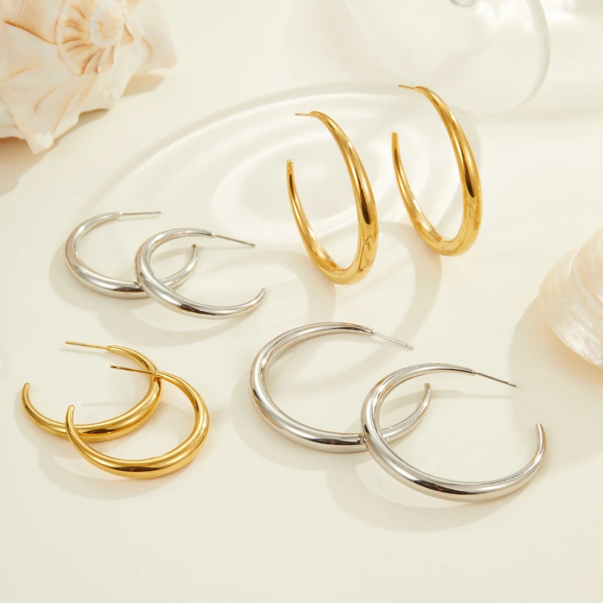 Titanium steel geometric round hoop earrings with 18K gold plating in small and large sizes