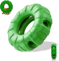 Blue natural rubber tyre-shaped dog chew toy with oval openings for treat dispensing.