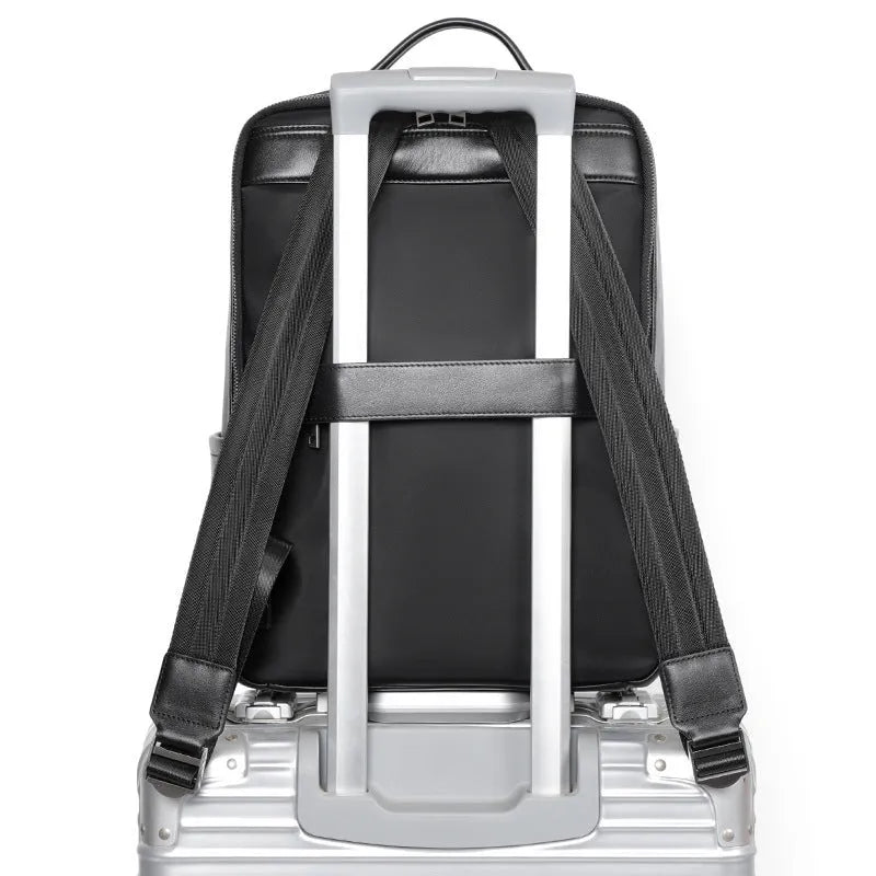 Large black genuine leather men's computer backpack with back support plate.